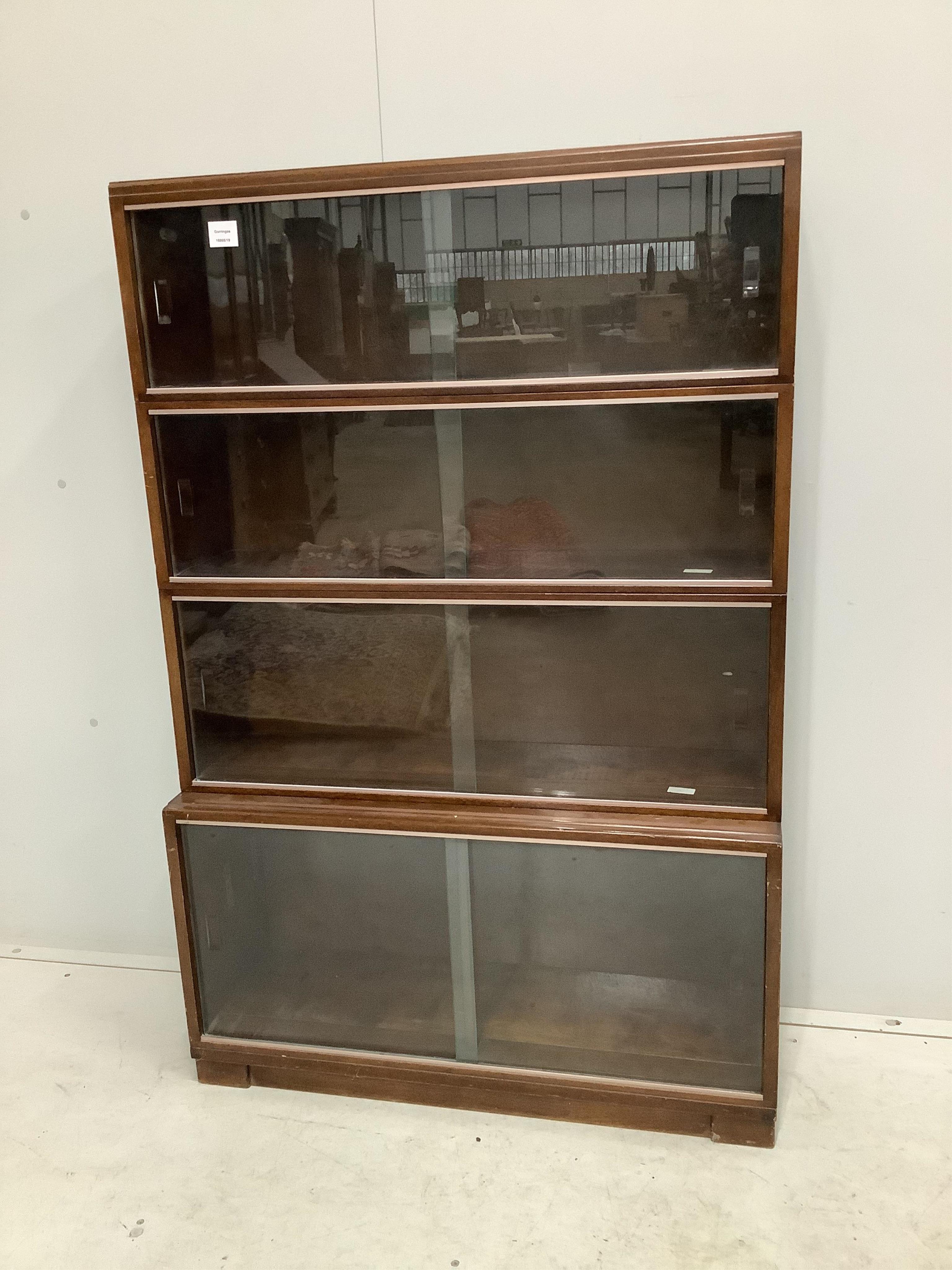 A Minty style mahogany four section bookcase, width 89cm, depth 29cm, height 135cm. Condition - fair to good